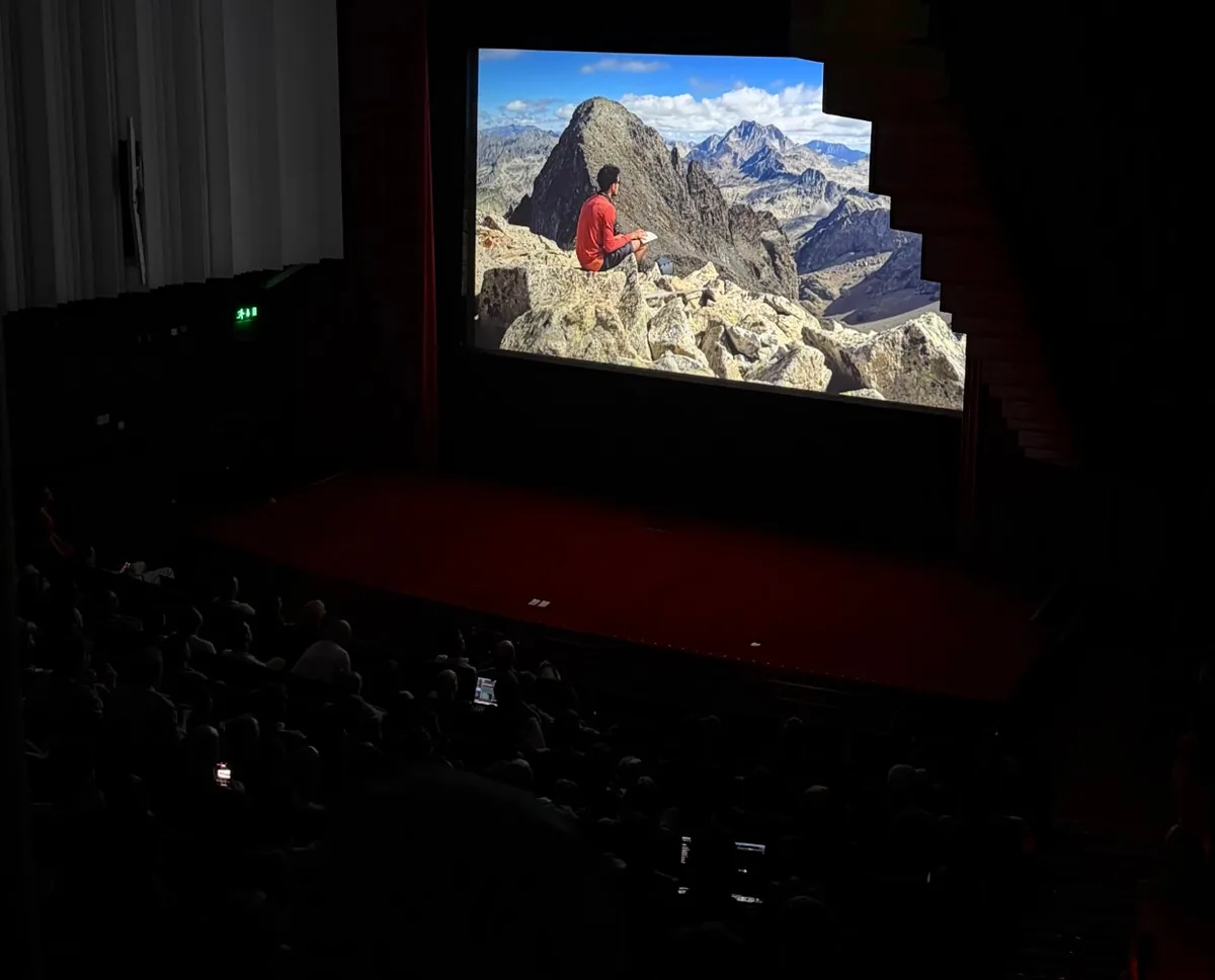 The film screened in the auditorium: Julien sitting on a Pyrenean summit