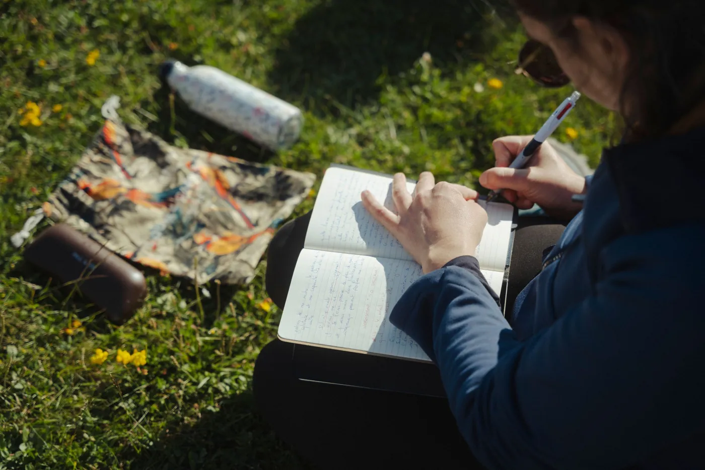 A participant writing in her notebook during the workshop on Dreaming